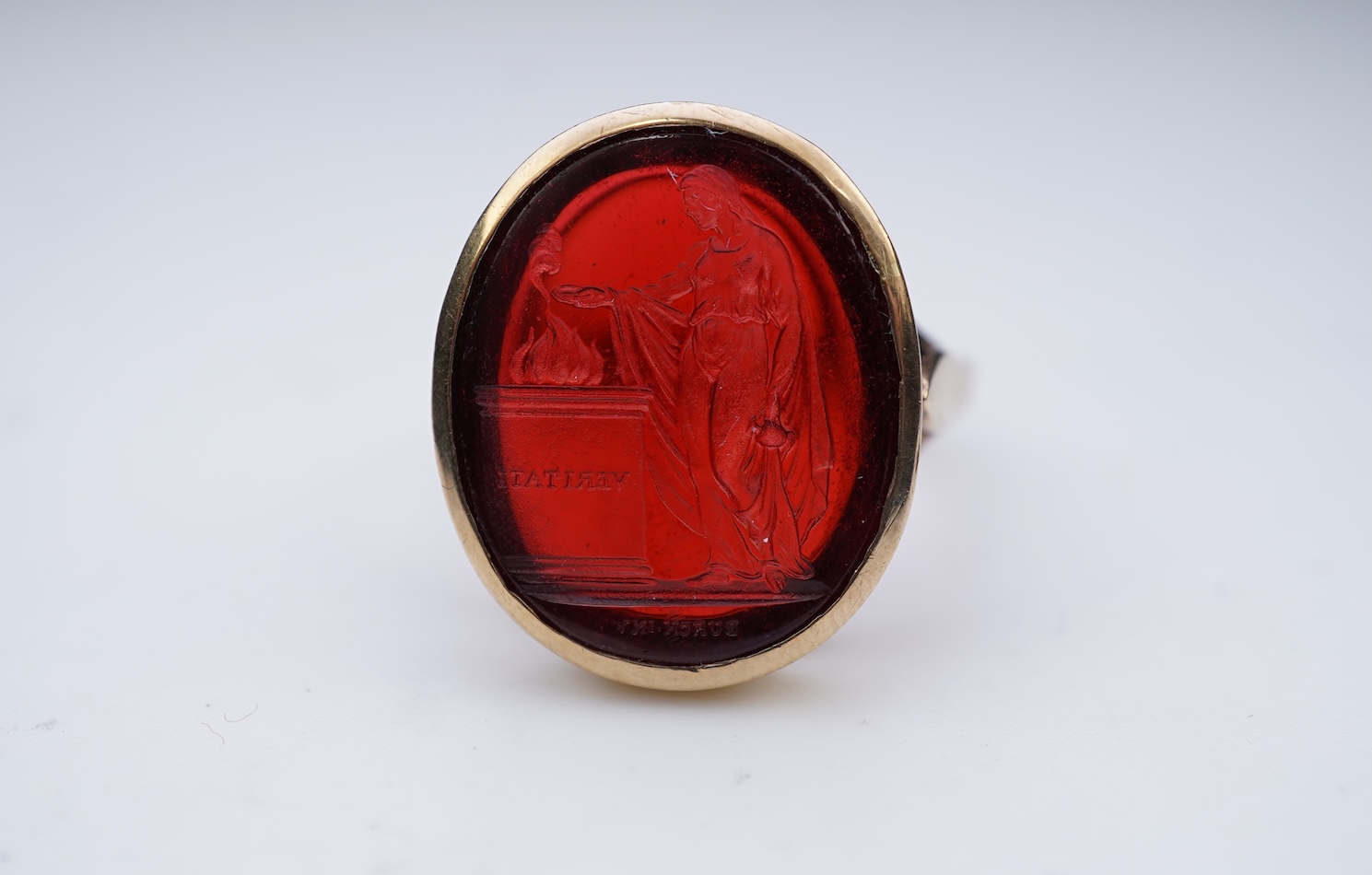 A glass intaglio ring, early 20th century
